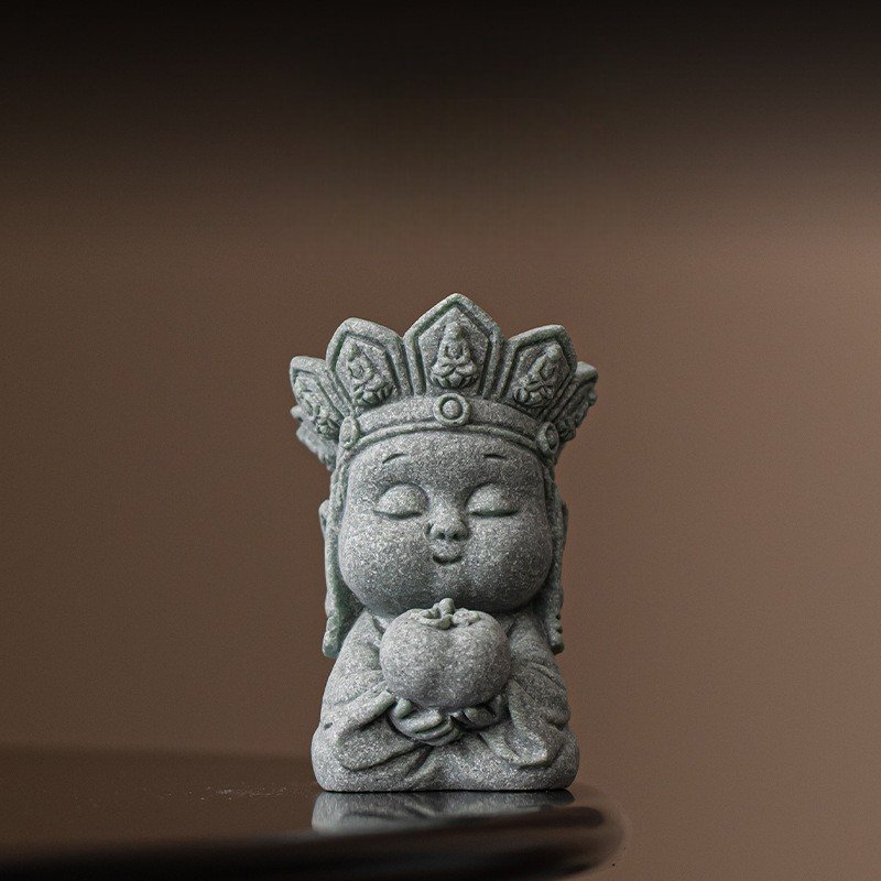 Cute little monk good luck charm holding a "Success" persimmon