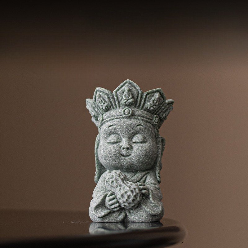 Cute little monk good luck charm holding an "Abundance" peanut