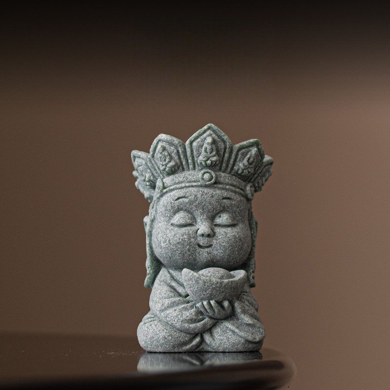 Cute "Wealth" monk statue holding a gold ingot