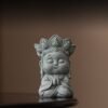 Cute "Rewards" monk statue in praying pose