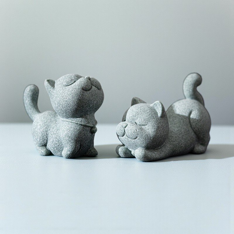 Green sandstone cat tea pet stretching and smiling, zen desk decor.