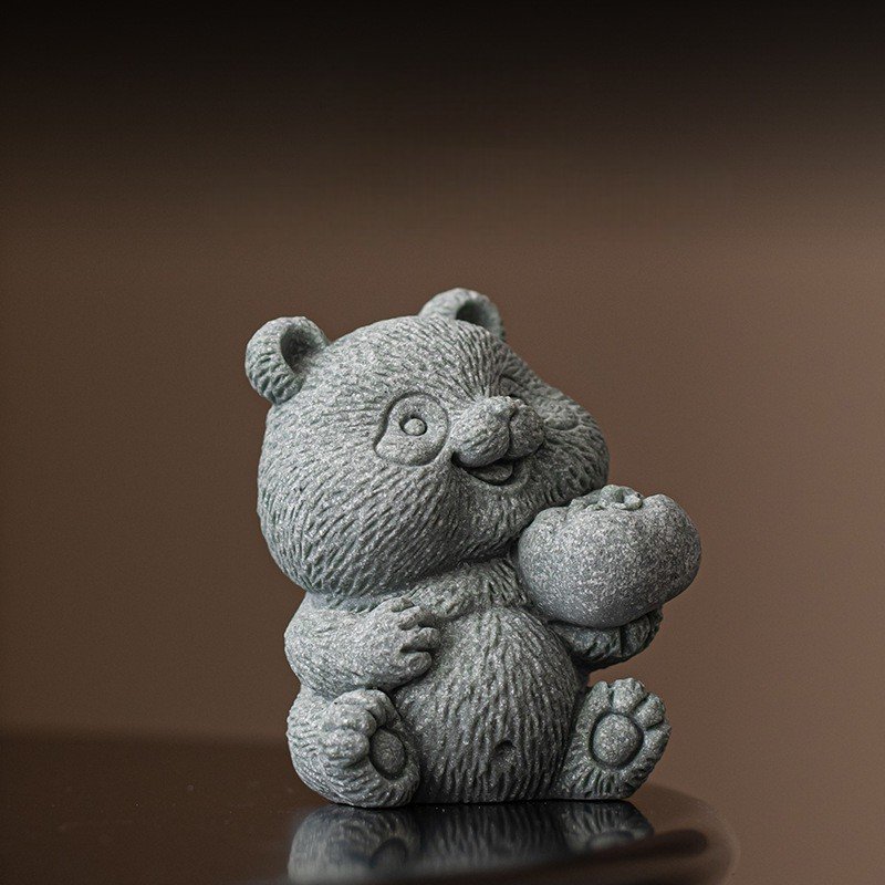 Wishes Come True" (Hao Shi) panda statue holding a persimmon